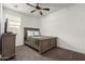 Bright bedroom with large window, neutral carpet, and updated furniture at 10347 S Saguaro Dr, Apache Junction, AZ 85120