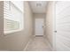 Bright entryway with tile floors, a white front door, a window and white doors at 10347 S Saguaro Dr, Apache Junction, AZ 85120
