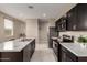 Bright, open kitchen with a center island, stainless steel appliances, and ample storage at 10347 S Saguaro Dr, Apache Junction, AZ 85120