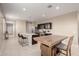 Spacious open floorplan kitchen with stone countertops and sleek black cabinetry at 10347 S Saguaro Dr, Apache Junction, AZ 85120