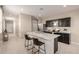 Lovely kitchen with a center island with seating and modern dark cabinetry at 10347 S Saguaro Dr, Apache Junction, AZ 85120