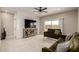 Comfortable living room with tile flooring, stylish sofas, and sliding glass doors at 10347 S Saguaro Dr, Apache Junction, AZ 85120
