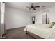Comfortable main bedroom showcasing a ceiling fan and an open doorway at 10347 S Saguaro Dr, Apache Junction, AZ 85120