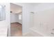 Clean bathroom with tub/shower combo and a glimpse into bedroom offers convenience and relaxation at 1037 E Dust Devil Dr, San Tan Valley, AZ 85143