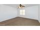Bedroom with neutral carpet, white walls, ceiling fan and natural light at 1037 E Dust Devil Dr, San Tan Valley, AZ 85143