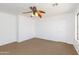Bright bedroom with a ceiling fan, neutral carpet and white walls at 1037 E Dust Devil Dr, San Tan Valley, AZ 85143
