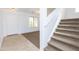 Inviting entryway with tiled floors, staircase and a front door that welcomes natural light and a cozy atmosphere at 1037 E Dust Devil Dr, San Tan Valley, AZ 85143