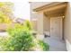 Close up view of home's front door, entry, landscaping, and front-facing two-car garage at 1037 E Dust Devil Dr, San Tan Valley, AZ 85143