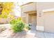 Close up view of home's front door, entry, landscaping, and front-facing two-car garage at 1037 E Dust Devil Dr, San Tan Valley, AZ 85143