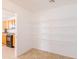 Walk-in pantry featuring shelving for storage adjacent to the kitchen at 1037 E Dust Devil Dr, San Tan Valley, AZ 85143