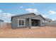 Exterior shot displaying the covered patio, generous window and stucco at 11432 E Utopia Ave, Mesa, AZ 85212