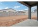 Spacious backyard with block wall and covered patio, ready for your personal touch at 11432 E Utopia Ave, Mesa, AZ 85212