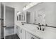Modern bathroom with dual sinks, sleek countertops, and contemporary fixtures at 11432 E Utopia Ave, Mesa, AZ 85212
