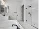 Bathroom featuring a soaking tub and shower with all-white finishes at 11432 E Utopia Ave, Mesa, AZ 85212