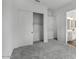 A bedroom boasts a closet with sliding doors and a bathroom with a sink and vanity at 11432 E Utopia Ave, Mesa, AZ 85212