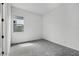 A room with a window showing an exterior wall and a cement block wall behind it at 11432 E Utopia Ave, Mesa, AZ 85212