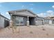 Charming single-Gathering home showcasing a gray exterior with desert landscaping at 11432 E Utopia Ave, Mesa, AZ 85212