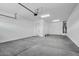 A spacious two-car garage features ample room for vehicles and storage at 11432 E Utopia Ave, Mesa, AZ 85212