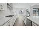 Gourmet kitchen features quartz countertops, stainless steel appliances, a gas cooktop and ample cabinet space at 11432 E Utopia Ave, Mesa, AZ 85212