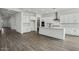 Open-concept space featuring a modern kitchen with an island and stainless steel appliances at 11432 E Utopia Ave, Mesa, AZ 85212