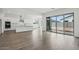 Open-concept living space featuring tile floors and a view of the kitchen and backyard at 11432 E Utopia Ave, Mesa, AZ 85212