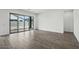 Spacious living room showcasing tile floors and sliding glass doors at 11432 E Utopia Ave, Mesa, AZ 85212