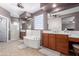 Well-lit primary bathroom with a soaking tub, double vanities, and a walk-in shower at 1147 E Lodgepole Dr, Gilbert, AZ 85298
