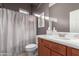 Full bathroom with a single sink vanity and shower with curtain at 1147 E Lodgepole Dr, Gilbert, AZ 85298
