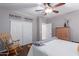 Bedroom with a rocking chair, light walls, and a Gilbert Arizona sign on the wall at 1147 E Lodgepole Dr, Gilbert, AZ 85298
