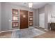 Elegant foyer with a dark wood door, stylish rug, and decorative windows adding character at 1147 E Lodgepole Dr, Gilbert, AZ 85298