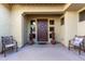 Inviting front porch with comfortable seating and a stylish wooden door, creating a welcoming entrance at 1147 E Lodgepole Dr, Gilbert, AZ 85298