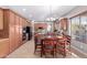 Open concept kitchen with dining area, featuring wood cabinetry and stainless steel appliances at 1147 E Lodgepole Dr, Gilbert, AZ 85298