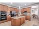 Spacious kitchen with a center island, stainless steel appliances, and ample cabinet space for storage at 1147 E Lodgepole Dr, Gilbert, AZ 85298