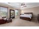 Spacious primary bedroom with a ceiling fan, and neutral-toned walls at 1147 E Lodgepole Dr, Gilbert, AZ 85298