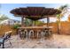 Stylish outdoor bar with seating, perfect for entertaining guests by the pool at 1147 E Lodgepole Dr, Gilbert, AZ 85298