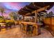 Backyard bar with seating, perfect for entertaining guests, and a built-in grill at 1147 E Lodgepole Dr, Gilbert, AZ 85298