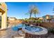 Luxurious pool and spa area with mature landscaping, perfect for relaxing outdoors at 1147 E Lodgepole Dr, Gilbert, AZ 85298
