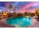 Sparkling swimming pool surrounded by lush landscaping, creating a private backyard retreat at 1147 E Lodgepole Dr, Gilbert, AZ 85298