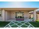 Spacious backyard features a covered patio and artificial turf with geometric design at 11574 W Levi Dr, Avondale, AZ 85323