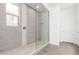 Modern bathroom featuring a walk-in shower with a glass enclosure at 11574 W Levi Dr, Avondale, AZ 85323