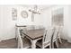 Dining room featuring an elegant chandelier, table, and chairs at 11574 W Levi Dr, Avondale, AZ 85323