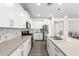 Modern kitchen featuring white cabinetry, stainless steel appliances, and stylish countertops at 11574 W Levi Dr, Avondale, AZ 85323