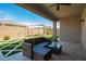 Inviting covered patio with modern outdoor seating, perfect for relaxation and outdoor living at 11574 W Levi Dr, Avondale, AZ 85323