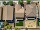 Aerial view of backyard featuring a small lawn, covered patio, and desert landscaping at 11732 W Foothill Dr, Sun City, AZ 85373