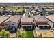Aerial view of the backyard, the roof of the home, the driveway and the other houses in the neighborhood at 11732 W Foothill Dr, Sun City, AZ 85373