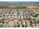Aerial view of a residential neighborhood with desert landscaping, community spaces and solar panels at 11732 W Foothill Dr, Sun City, AZ 85373