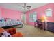 Bright bedroom featuring stylish furniture, a ceiling fan, and lots of natural light at 11732 W Foothill Dr, Sun City, AZ 85373