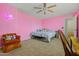 Bright and airy bedroom with modern decor, a ceiling fan, and soft neutral carpet at 11732 W Foothill Dr, Sun City, AZ 85373