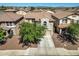 An aerial view of a two story home displaying the driveway, landscaping and tile roof in a close knit community at 11732 W Foothill Dr, Sun City, AZ 85373