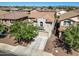 An aerial view of a two story home displaying the driveway, landscaping and tile roof in a close knit community at 11732 W Foothill Dr, Sun City, AZ 85373